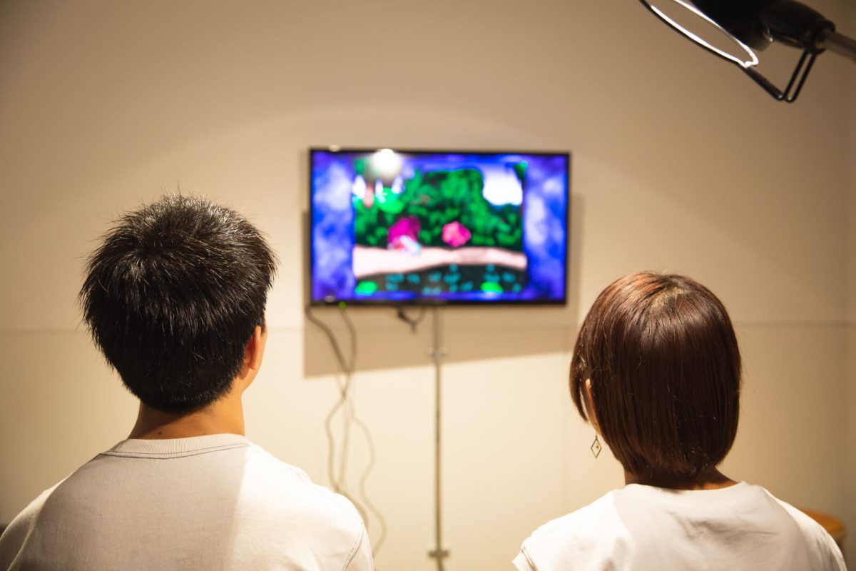 unrecognizable young couple playing video game at home infancias